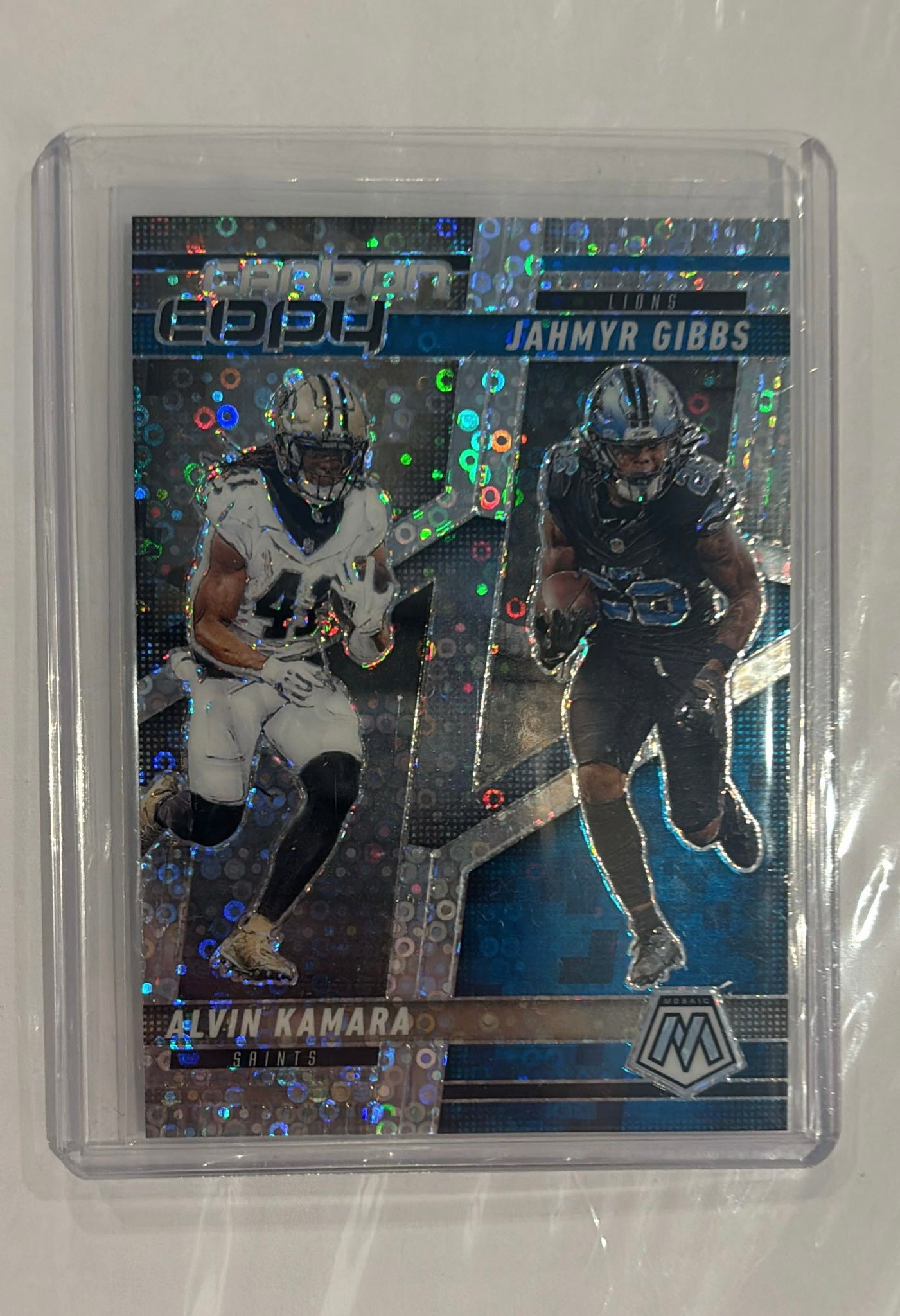 Jahmyr Gibbs/ Alvin Kamara Panini Mosaic Trading Card